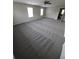 A view of the spacious bedroom with a ceiling fan and two windows at 2748 Farmstead Ct, Grayson, GA 30017