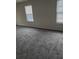 Bright bedroom with carpet floors and natural light from windows at 2748 Farmstead Ct, Grayson, GA 30017