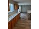Bright kitchen featuring wood cabinetry, white countertops and backsplash at 2748 Farmstead Ct, Grayson, GA 30017