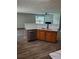 Kitchen island with stainless steel dishwasher, wood cabinets, and white countertops at 2748 Farmstead Ct, Grayson, GA 30017