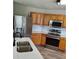 Updated kitchen boasts stainless steel appliances, and wood cabinetry at 2748 Farmstead Ct, Grayson, GA 30017