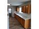 Bright kitchen featuring wood cabinetry, white countertops and backsplash at 2748 Farmstead Ct, Grayson, GA 30017