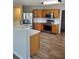 Well-lit kitchen with wood cabinets, stainless steel appliances, and white countertops at 2748 Farmstead Ct, Grayson, GA 30017