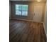 Inviting living space featuring new flooring, a bright window, and neutral paint at 2748 Farmstead Ct, Grayson, GA 30017