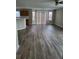 Open living area with vinyl floors and sliding doors to the backyard at 2748 Farmstead Ct, Grayson, GA 30017