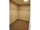 Neutral toned carpeted walk-in closet with wire rack shelving at 2748 Farmstead Ct, Grayson, GA 30017