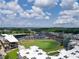 Aerial view of baseball stadium, mixed-use buildings, and beautiful blue skies at 2625 Poppy Ct, Buford, GA 30519