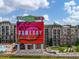 Exterior view of apartments with 'Gameday' signage and a view of Coolray Field at 2625 Poppy Ct, Buford, GA 30519