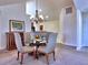 Inviting dining area with stylish chairs, a glass-topped table and attractive chandelier at 2730 Vintage Reserve Ln, Marietta, GA 30066