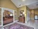 Bright hallway featuring tile floors, a decorative rug, and elegant furnishings near the dining area at 2730 Vintage Reserve Ln, Marietta, GA 30066