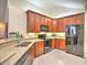 Functional kitchen with stainless steel appliances, generous counter space, and lots of rich wood cabinets at 2730 Vintage Reserve Ln, Marietta, GA 30066