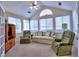 Bright sunroom featuring a vaulted ceiling, lots of natural light, and comfortable seating for relaxing at 2730 Vintage Reserve Ln, Marietta, GA 30066