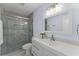 Bathroom with a sleek glass-enclosed shower, modern vanity, and elegant finishes at 2886 Webb Bridge Rd, Alpharetta, GA 30009