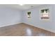 Bedroom featuring hardwood flooring and natural light, creating a bright and airy living space at 2886 Webb Bridge Rd, Alpharetta, GA 30009