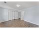 Bedroom featuring wood-look flooring, closet, and a doorway leading to another room at 2886 Webb Bridge Rd, Alpharetta, GA 30009