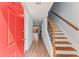 Inviting entryway features a staircase with decorative railing and sleek wood laminate flooring at 2886 Webb Bridge Rd, Alpharetta, GA 30009