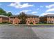 Charming townhomes featuring a brick facade and red front doors at 2886 Webb Bridge Rd, Alpharetta, GA 30009