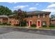 Charming townhomes featuring a brick facade and red front doors at 2886 Webb Bridge Rd, Alpharetta, GA 30009