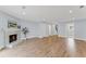 Light-filled living room featuring wood floors, a fireplace, and a neutral color palette at 2886 Webb Bridge Rd, Alpharetta, GA 30009