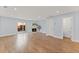Bright living room with fireplace, sliding glass doors to patio and sleek wood laminate flooring at 2886 Webb Bridge Rd, Alpharetta, GA 30009