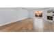 Bright living room with wood floors, fireplace, and sliding door to the patio at 2886 Webb Bridge Rd, Alpharetta, GA 30009