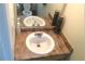 Bathroom featuring a vanity with a large sink, mirrored backsplash and stylish decor, offering a cozy area at 4232 Kensington Cv, Atlanta, GA 30349