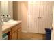 Bathroom with a vanity with storage and closet, offering functionality at 4232 Kensington Cv, Atlanta, GA 30349