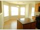 Cozy kitchen nook featuring large windows, a central island, and view of the kitchen, creating a pleasant dining area at 4232 Kensington Cv, Atlanta, GA 30349