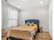 Bedroom featuring a comfortable bed, soft lighting, and hardwood floors at 613 Harrington Hls, Decatur, GA 30032