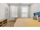 Bedroom featuring lots of natural light, wood floors, and modern interior design at 613 Harrington Hls, Decatur, GA 30032