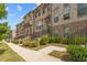 Beautiful brick townhomes with manicured landscaping and inviting walkways at 613 Harrington Hls, Decatur, GA 30032