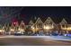Night shot of charming Tudor style buildings, adorned with holiday lights, creating a festive atmosphere in a walkable community at 613 Harrington Hls, Decatur, GA 30032