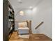 Hallway nook with hardwood floors, bookcase, chair, and reading area at 613 Harrington Hls, Decatur, GA 30032