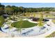 Serene park featuring a circular green space, an inviting amphitheater, and winding paths for leisurely strolls and community enjoyment at 613 Harrington Hls, Decatur, GA 30032