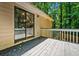 A backyard wooden deck with a sliding glass door providing entry into the home at 1131 Hershey Dr, Marietta, GA 30062