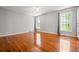 Spacious bedroom with hardwood floors, ceiling fan, and large windows at 1131 Hershey Dr, Marietta, GA 30062