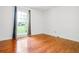 Bedroom with hardwood floors, large window, and white walls at 1131 Hershey Dr, Marietta, GA 30062