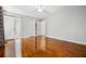 Spacious bedroom with hardwood floors and a door leading to the en suite bathroom at 1131 Hershey Dr, Marietta, GA 30062