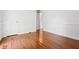 Bedroom with hardwood floors, white walls, baseboards, and window at 1131 Hershey Dr, Marietta, GA 30062
