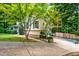 Charming home exterior with well-maintained landscaping and a driveway leading to the garage at 1131 Hershey Dr, Marietta, GA 30062