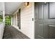 Inviting covered front porch featuring a dark-stained door and classic railing at 1131 Hershey Dr, Marietta, GA 30062