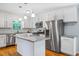 Modern kitchen with white cabinetry, stainless steel appliances, and granite countertops at 1131 Hershey Dr, Marietta, GA 30062