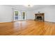 Expansive living room featuring wood floors, a fireplace, and lots of windows at 1131 Hershey Dr, Marietta, GA 30062
