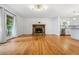 Open living space with hardwood flooring, a fireplace, and an abundance of natural light at 1131 Hershey Dr, Marietta, GA 30062