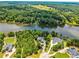 Gorgeous aerial view of large lakefront properties surrounded by lush green trees, providing a secluded atmosphere at 55 Moray Pl, Covington, GA 30014