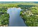 Panoramic aerial view of a lake community surrounded by trees at 55 Moray Pl, Covington, GA 30014