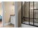 Bathroom showcasing a walk-in shower with tile and glass, a vanity, and a toilet at 55 Moray Pl, Covington, GA 30014