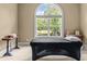 Bedroom featuring hardwood floors, an arched window, and a massage table at 55 Moray Pl, Covington, GA 30014