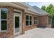 Spacious deck is perfect for outdoor entertaining with brick exterior and lovely view at 55 Moray Pl, Covington, GA 30014