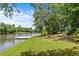 Picturesque waterfront property with a private dock and seating area at 55 Moray Pl, Covington, GA 30014